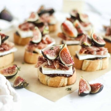 Brie toasts with prosciutto and fig jam.