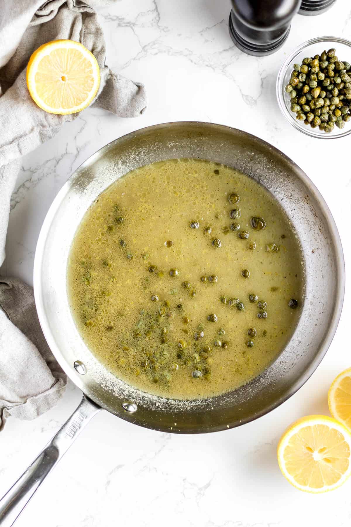 Piccata sauce with butter, lemon juice, and capers.