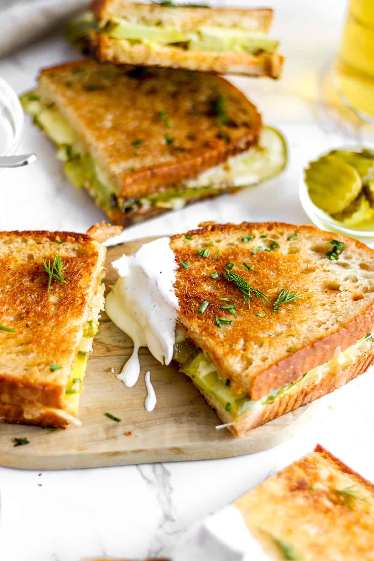 Sandwich with herbs dipped in ranch.