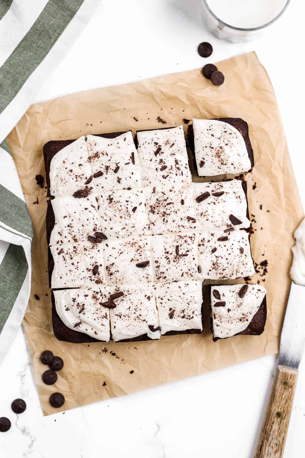 Brownies with cream cheese frosting cut into squares.