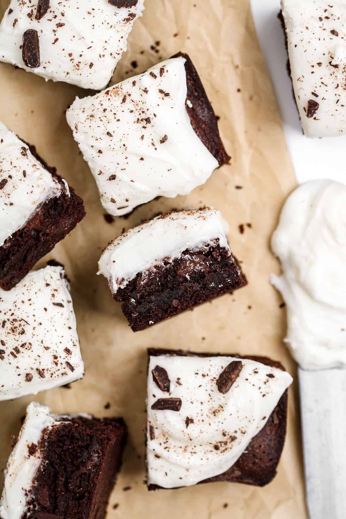Brownies with cream cheese frosting and chocolate shavings.