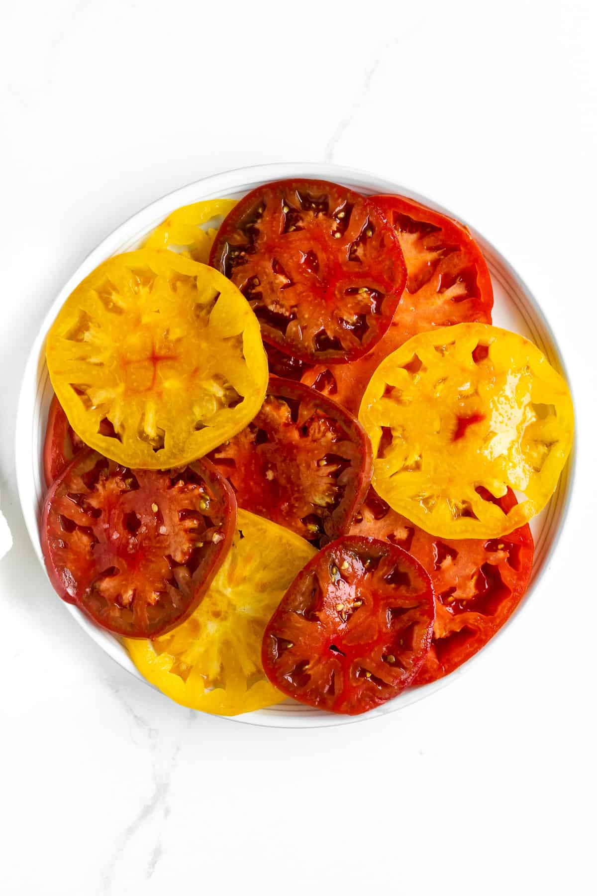 Sliced tomatoes on platter.