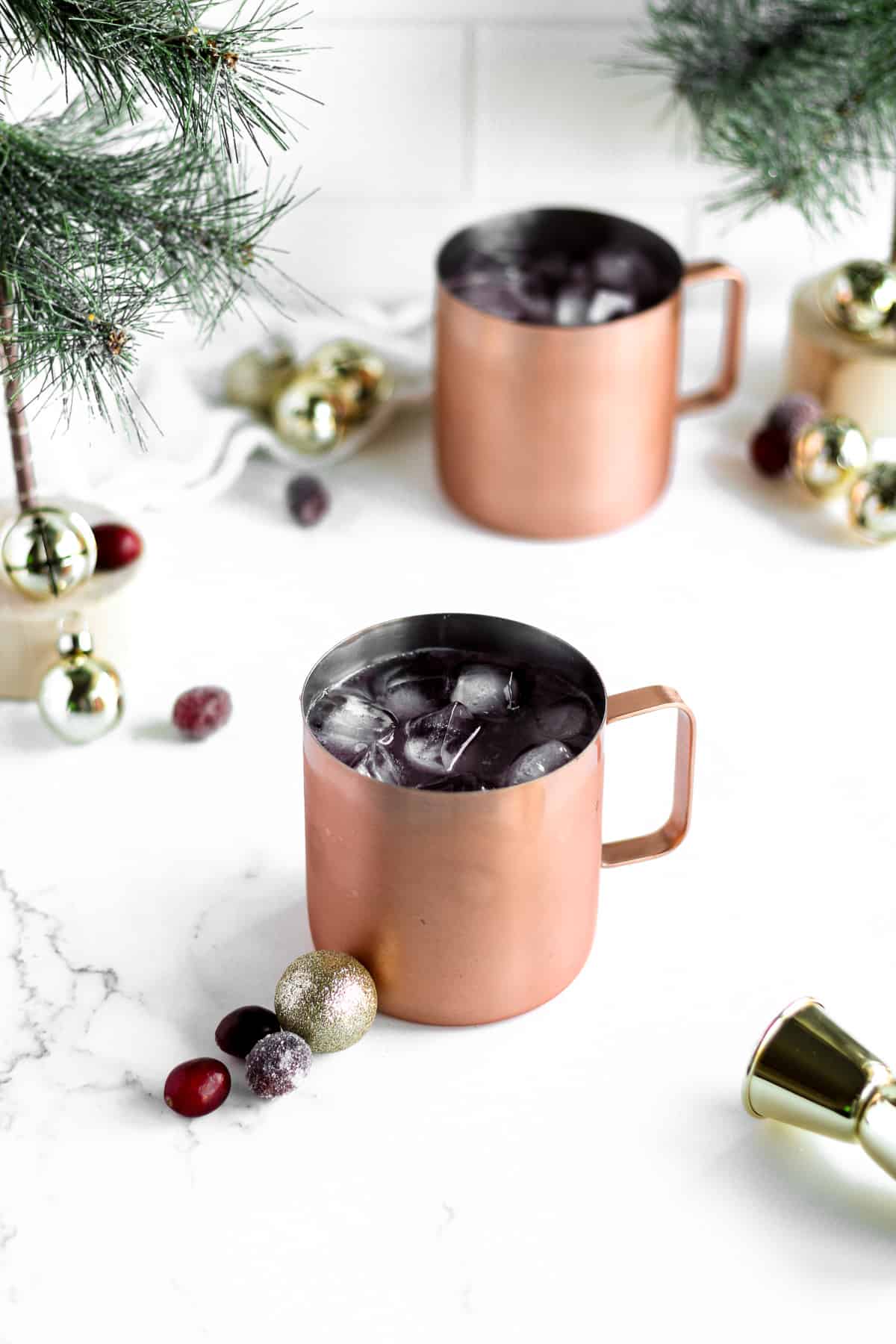 Cocktail poured into copper mug filled with ice.